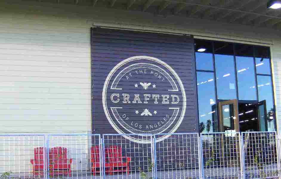 CRAFTED sign on outdoor patio and front door of CRAFTED year-round crafts marketplace