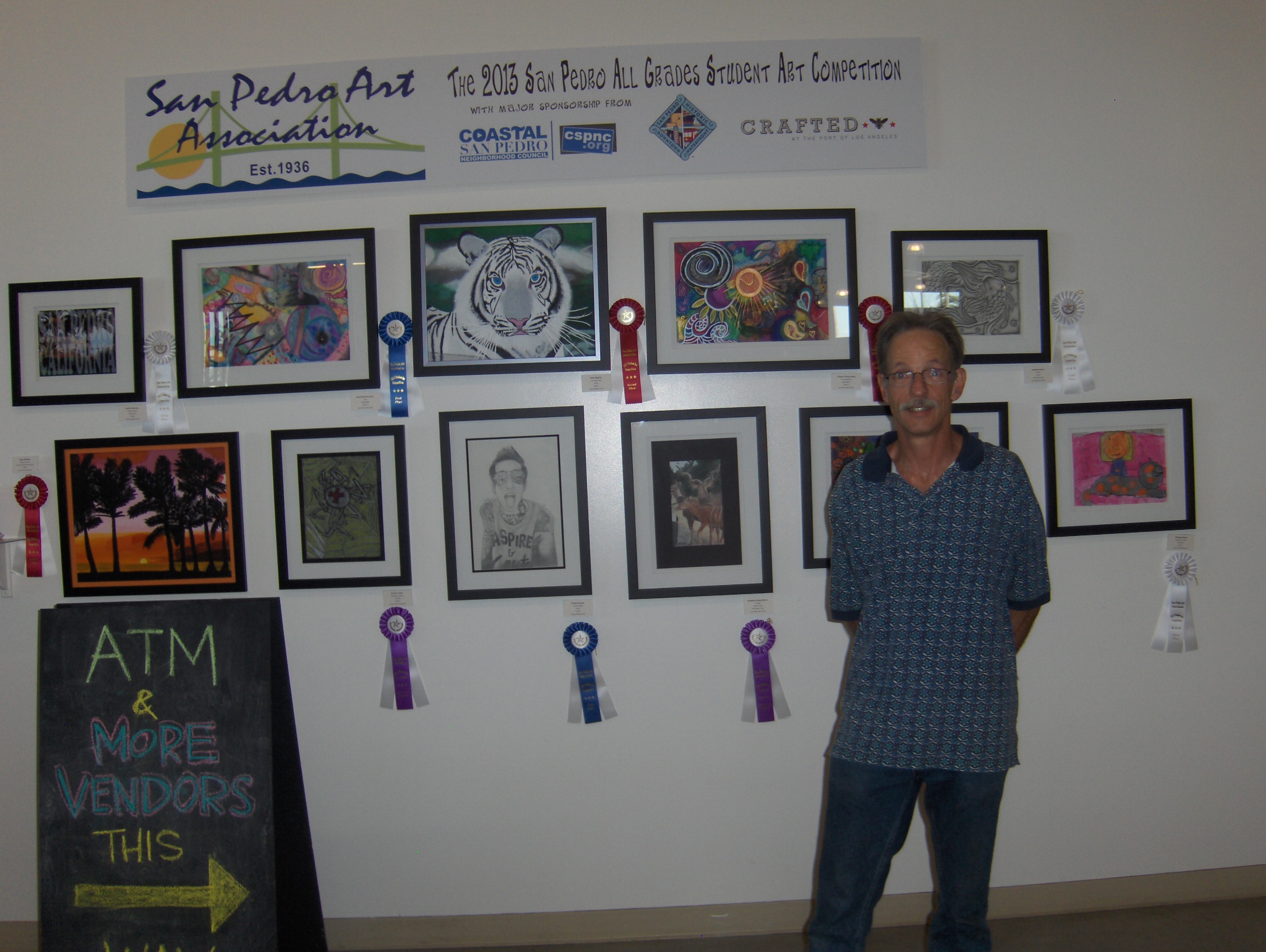 Steve Magee with art for SPAA Student Competition
