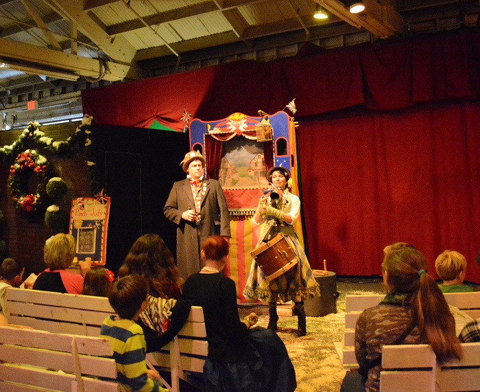 Punch and Judy show performs on a puppet stage