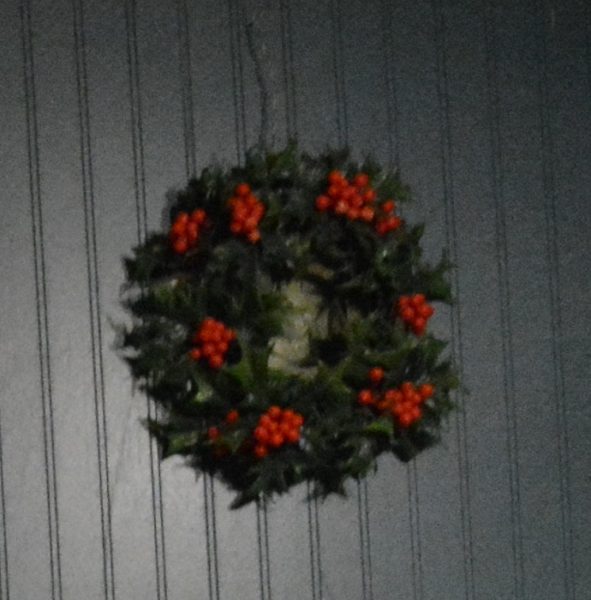 Christmas wreath on white wall