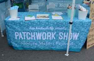 Patchwork Show blue tablecloth atop entrance table