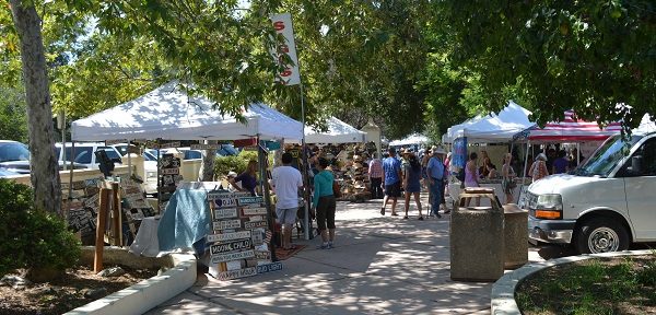 Shoppers browse tented exhibits in Libbey Park during Ojai Valley Lavender Festival