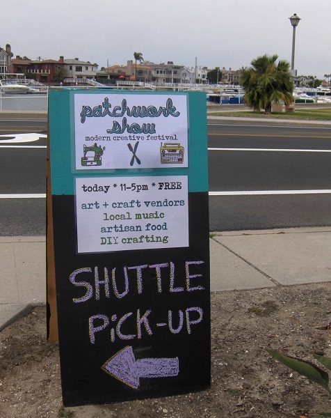 Patchwork Show sign sits near Marine Stadium in Long Beach.