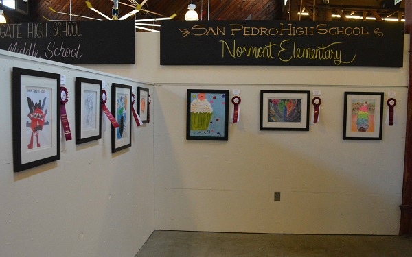 Student art hangs on the wall at CRAFTED facility