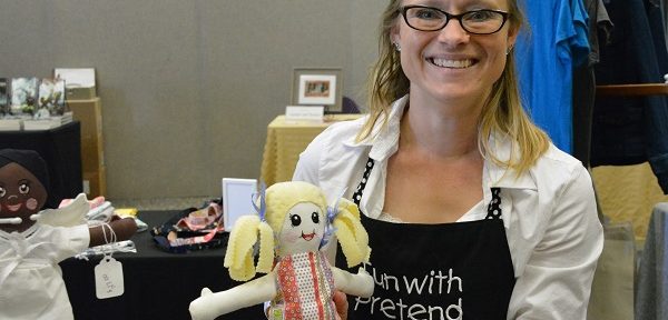 Krystina Kyle with one of her handmade rag dolls