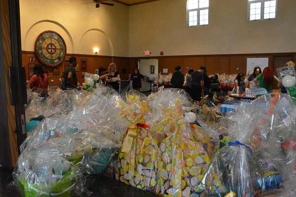Easter baskets in foreground as volunteers work
