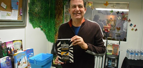Author Mark Fine with his book The Zebra Affaire