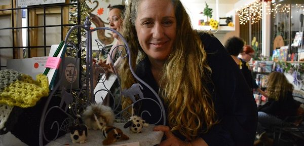 Author and artist Robin Kinnaman-Nieto with her needlefelted dogs