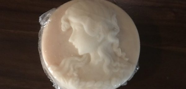 pink soap that looks like a cameo with a woman's head in white
