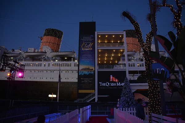 Queen Mary with lighted smokestacks and CHILL sign
