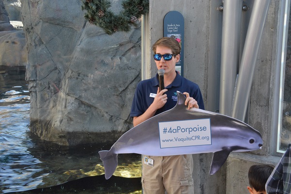 Volunteer Cameron with vaquita conservation socail-media sign