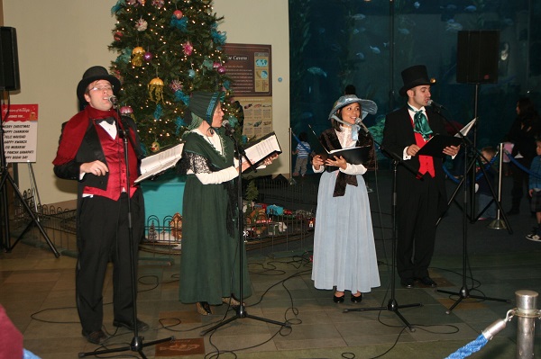 Christmas carolers singing at the Aquarium of the Pacific
