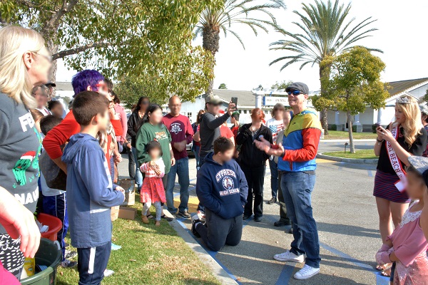 Community activisit Justin Rudd talks with gatherwed group of volunteers outside Long Beach Animal Care Services