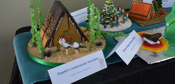 A row of Aquarium-themed gingerbread houses on a table