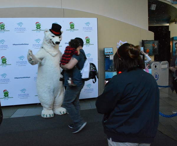 costumed polar bear poses for pictures