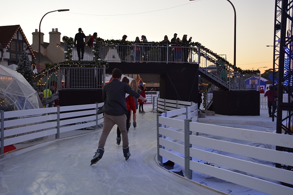 skaters skate through CHILL on an ice-skating track