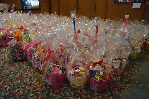 numerous completed Easter baskets on the floor