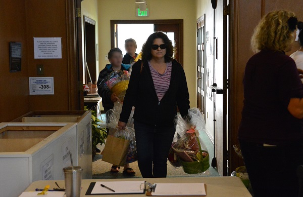 Volunteers delivers completed Easter baskets and supplies