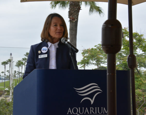 Dr. Sandy Trautwein speaks from Aquarium of the Pacific lectern
