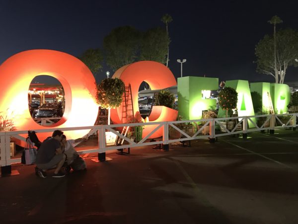 Lighted "OC FAIR" sign welcomes visitors at night