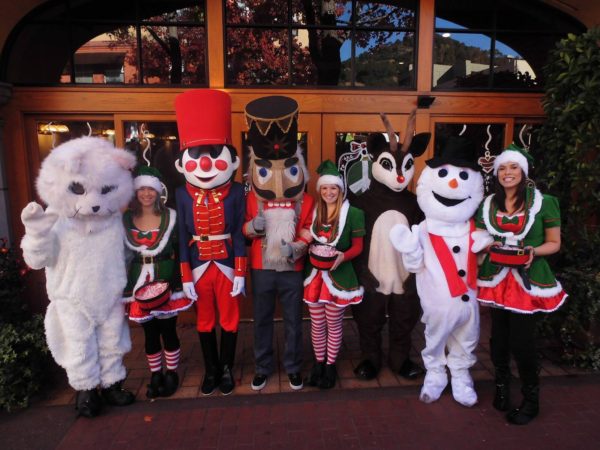 Costumed snowman, toy soldiers, reindeer and bear in San Rafael Parade of Ligths