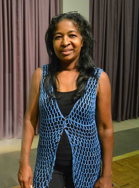 Designer Paula Bennett in a blue crocheted vest