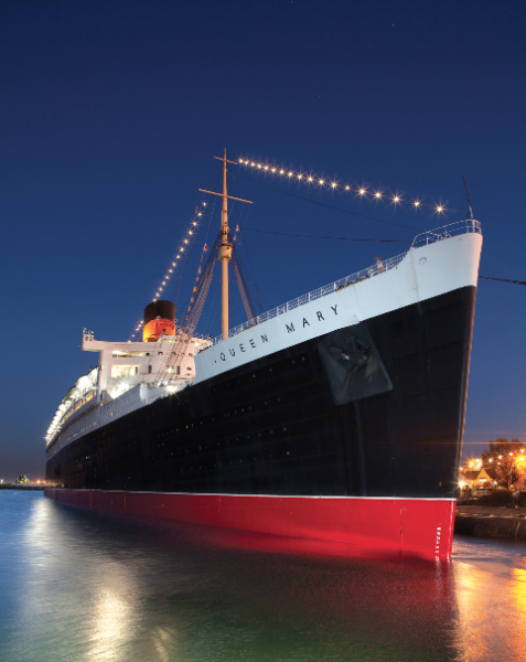 Queen Mary with lights over her bow at night