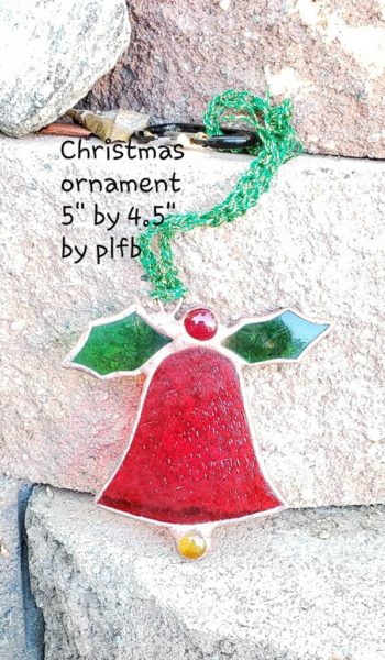 Red stained-glass bell with green holly leaves and red holly berry