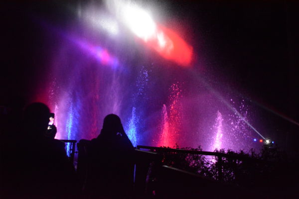 Laser glow above "Splashes of Light" show at L.A. Zoo Lights