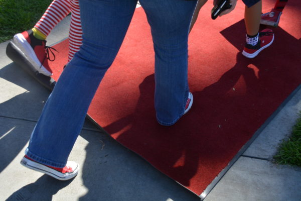 closeup of red sneakers on the red carpet