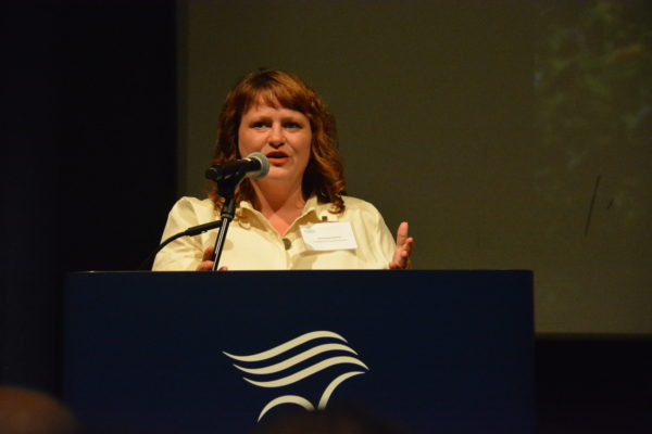 Councilmember Jeannine Pearce speaks from Aquarium of the Pacific podium