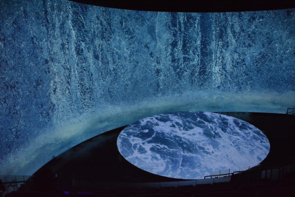waterfall projected down curved side screen and over disc screen on floor