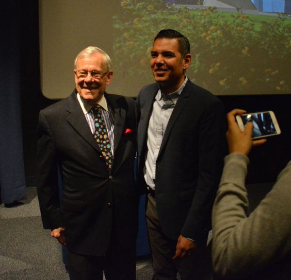 Aquarium President Dr. Jerry Schubel poses with Long Beach Mayor Robert Garcia as reporters snap pictures