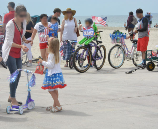 Parade participants gather at the boat landing after Great American 4th of July Kids' Bike Parade