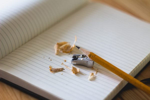 Pencil with sharpener on a notebook page