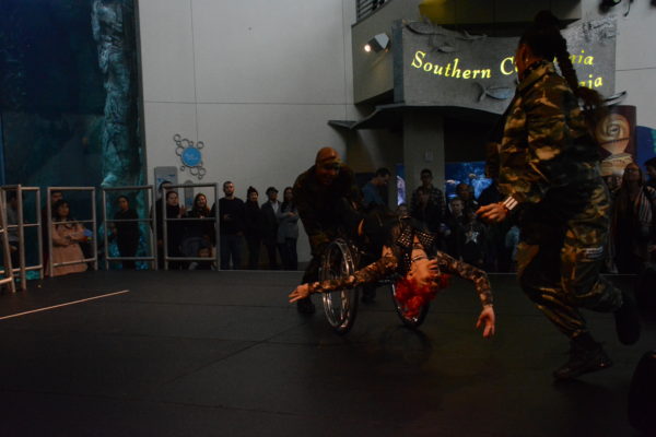 Auti Angel leans back from wheelchair and executes a spin while at a 45-degree angle from the floor