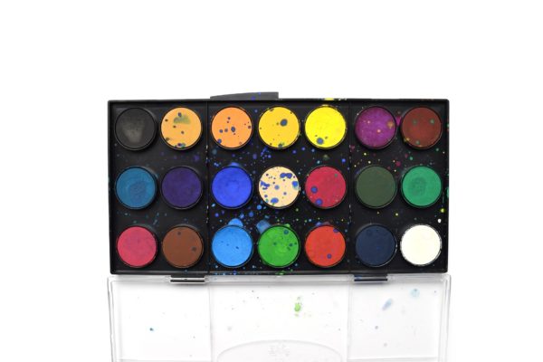Palette of 21 watercolor paints in rainbow colors including blue, yellow, purple and magenta