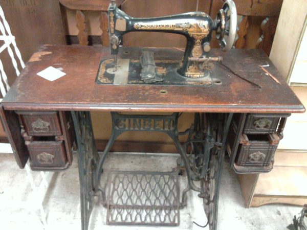 Antique iron black Singer sewing machine with foot treadle