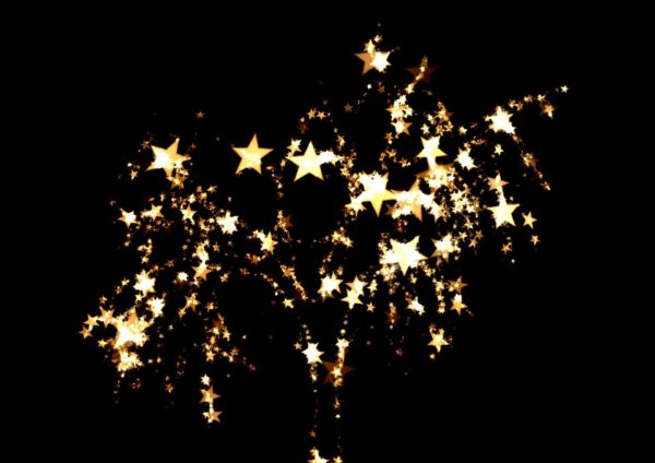 Sparkly explosion of gold stars against a black background
