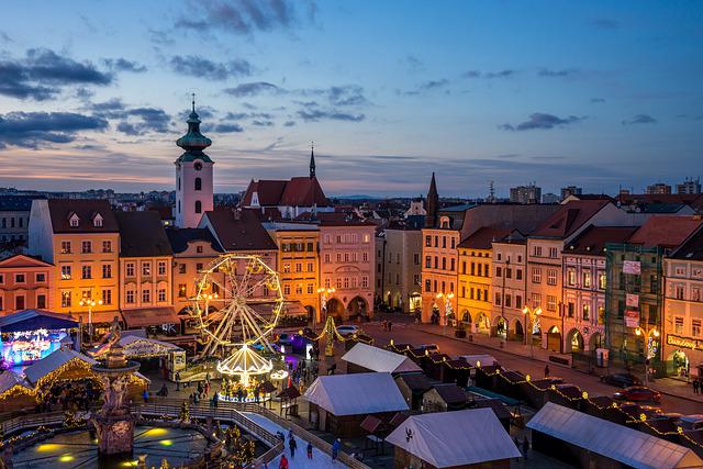 Christmas market at sunset with Ferris wheel and tents set up