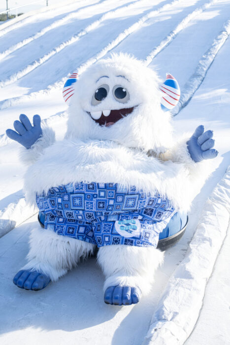 Yowie the Yeti slides down a ice slide