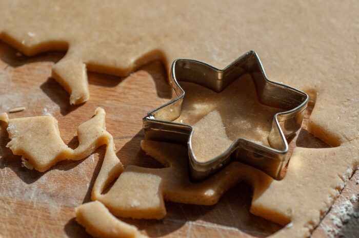 Gingerbread dough with a star-shaped cooky cutter on it