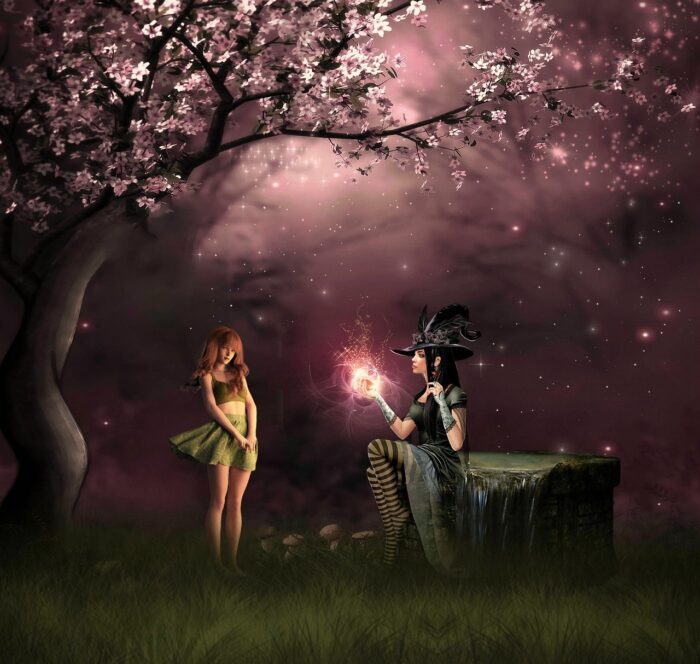 Girl and witch in a magical woods as witch displays a wand with a glowing gold tip