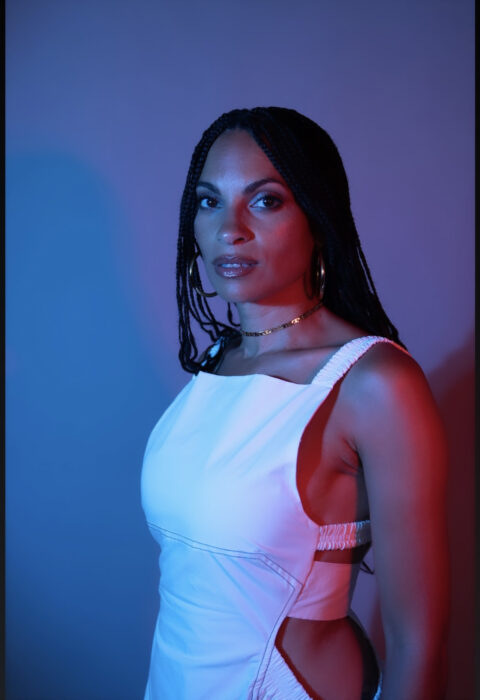 Goapele, in a white-strapped gown