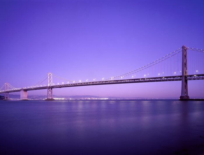 Oakland Bay Bridge against a lavender evening sky