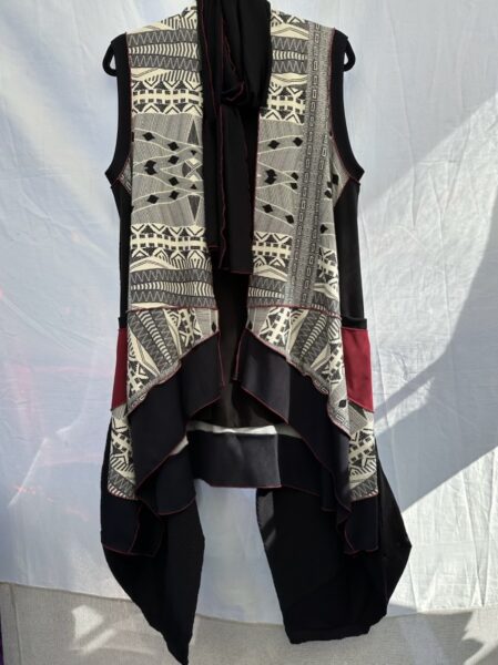 Black vest with lacy black-and-white pattern and coattail sides.