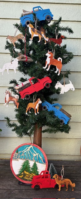 Christmas tree with dog ornaments made of wood or paper