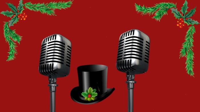 Red background with two old-time radio-style mics, with a top hat with holly in between then and holly leaves bordering each side of the picture.