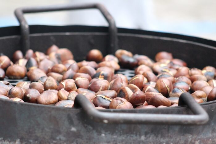 Closeup on chestnuts in an iron pot