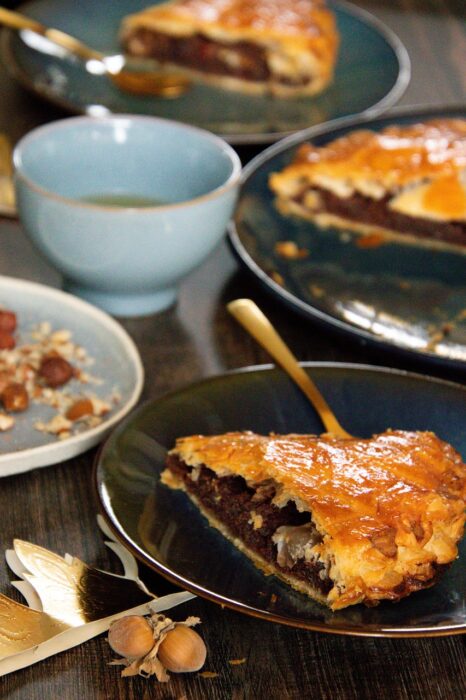 Slices of "king cake" on a table with coffee cup
